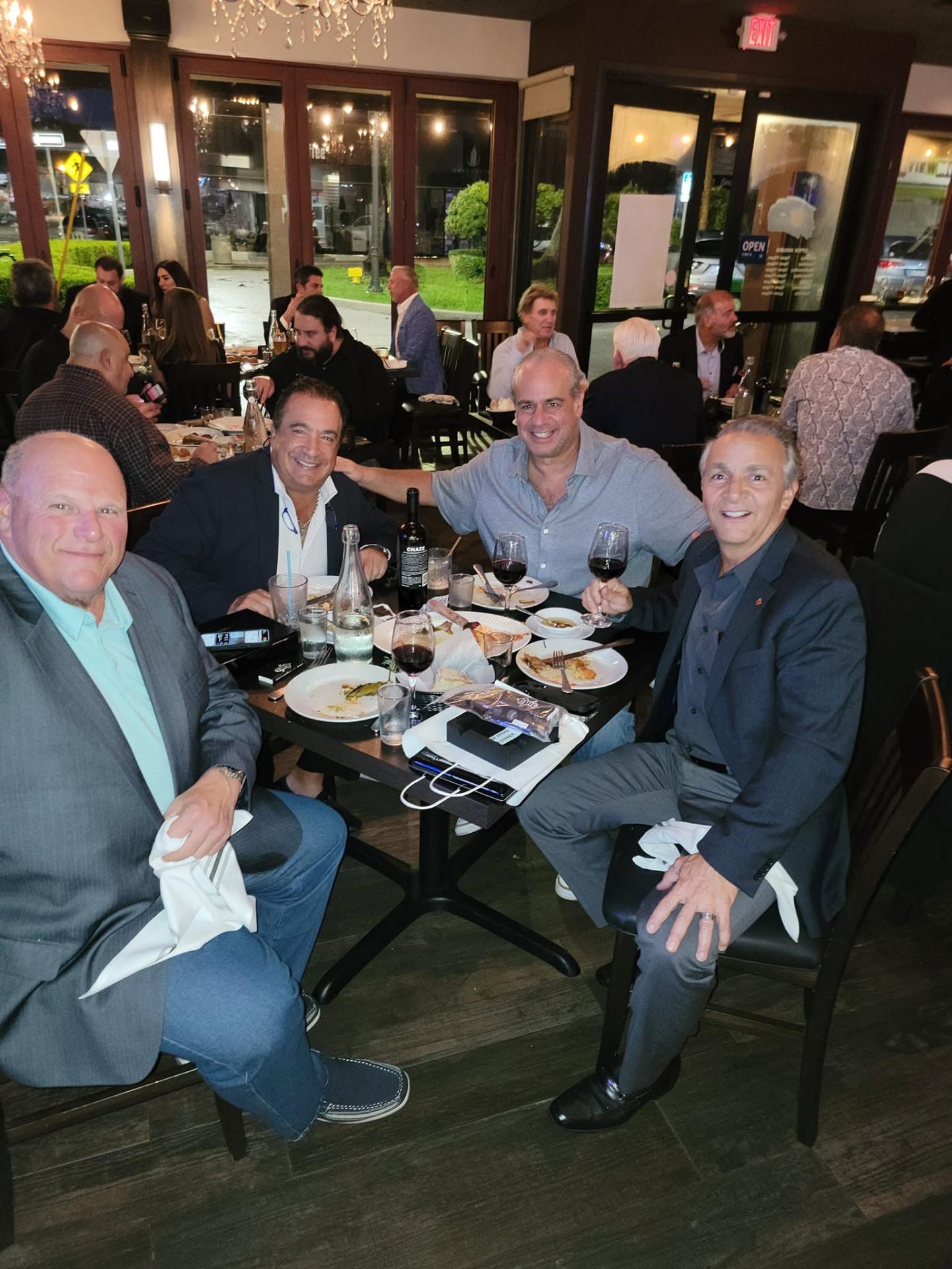 Guests enjoying food and wine